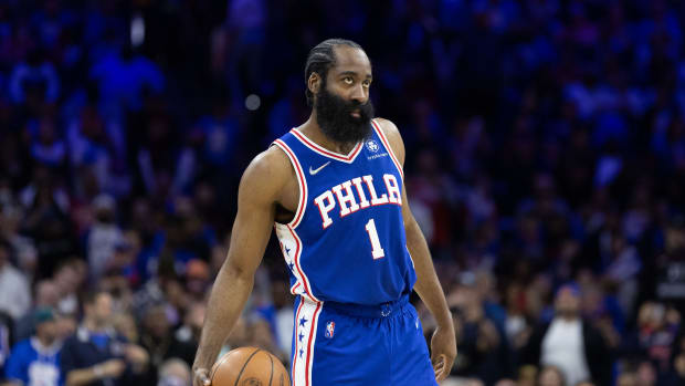 James Harden standing with the basketball.